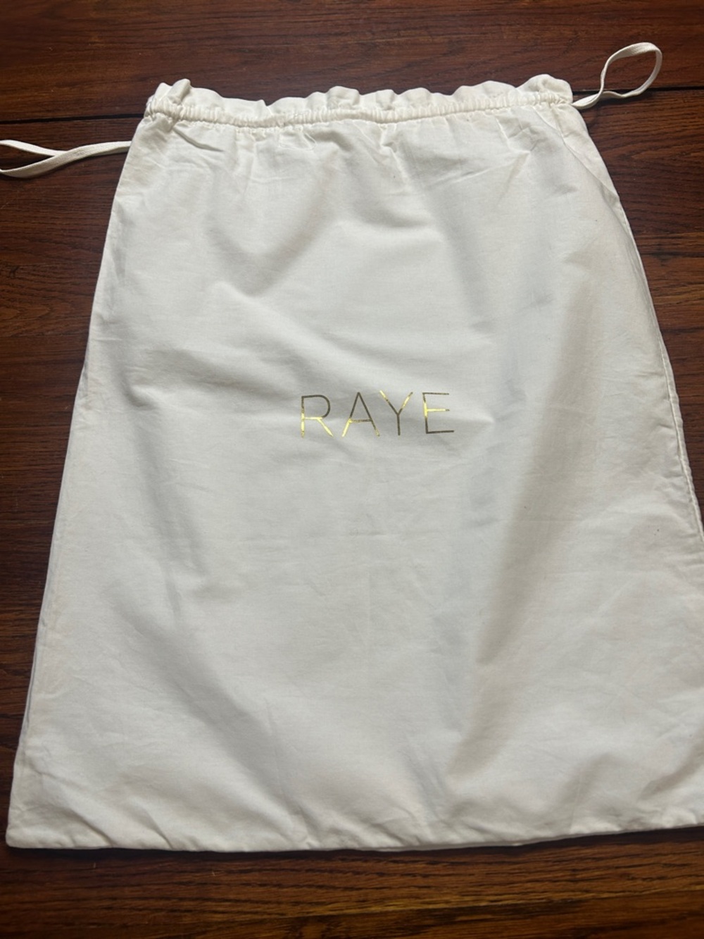 RAYE Cream Drawstring Dust Bag with Gold Logo